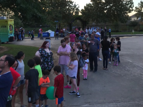 neighbors gathering at the national night out event