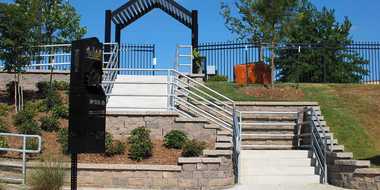 Three sets of stairs near park entrance